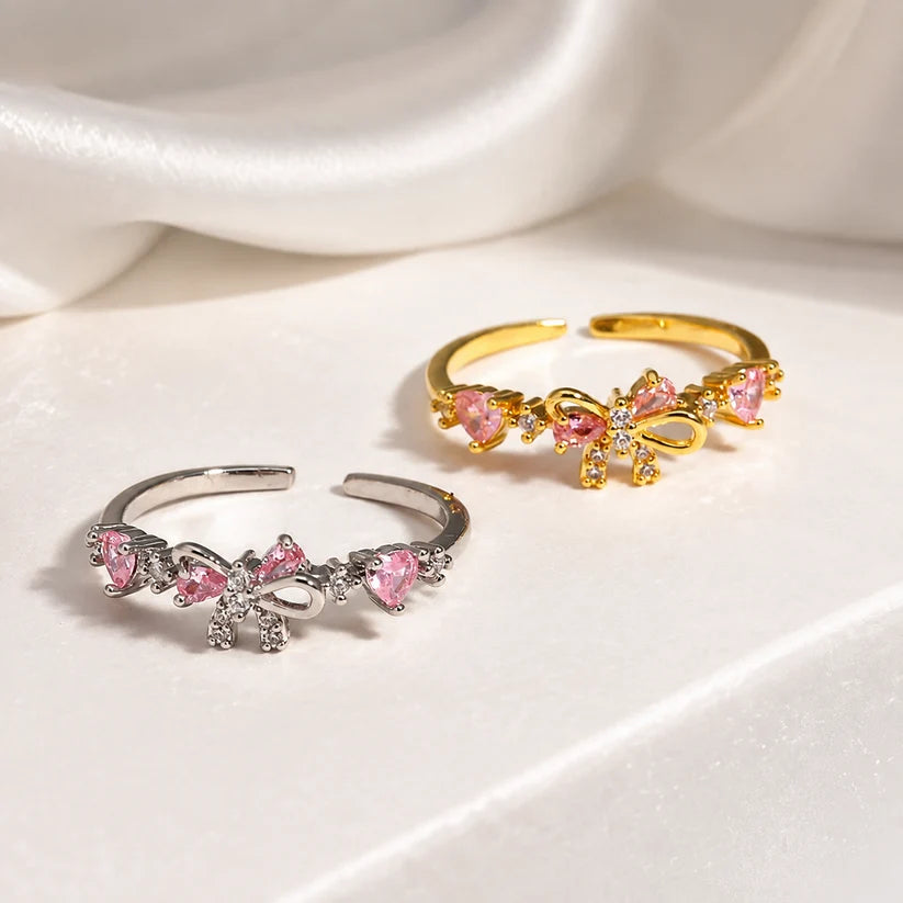 Anillos de mejores amigas con lazo y cristales rosados en tono plateado y dorado