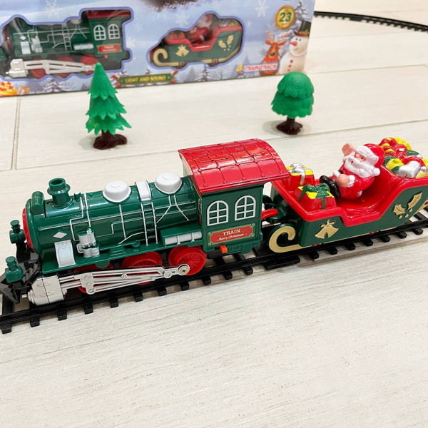 Diseño de tren navideño multicolor con figuras decorativas